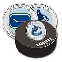 VANCOUVER CANUCKS -  VANCOUVER CANUCKS LOGOS IN A HOCKEY PUCK -  2009 CANADIAN COINS